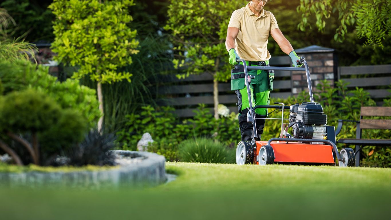 A man lawn mowing